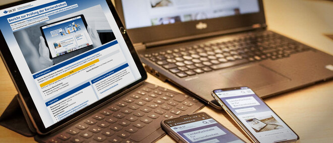 Tablet, Laptop und Smartphones auf einem Tisch zeigen eine Webseite - zur Artikelseite Überwachungsstellenbericht 2023